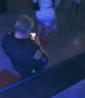 Policial é flagrado fotografando mulher que assistia show do Drake nos EUA